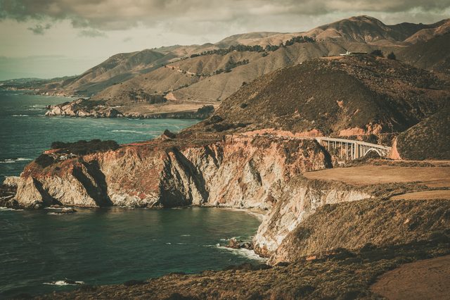 Scenic California coast illustrating state child support enforcement tools including wage garnishment and DCSS services