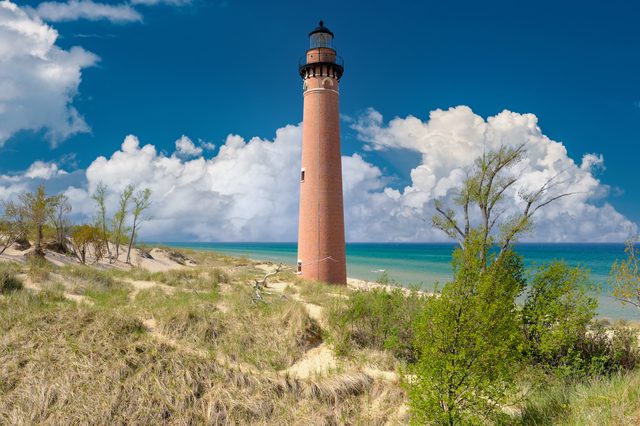 Michigan lighthouse in sand dunes representing child support enforcement tools under MCL Chapter 552