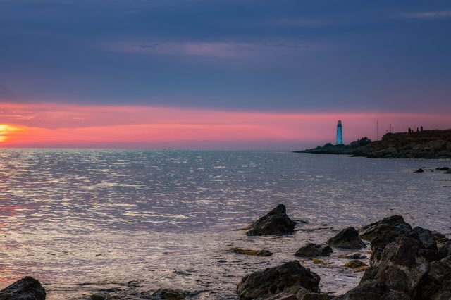 Rhode Island sunset over beach representing property division in divorce proceedings