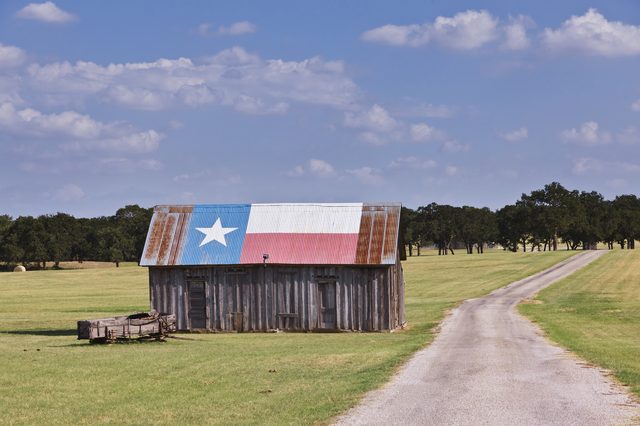 Texas barn painted with the Texas flag colors